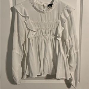 White ruffles blouse with eyelet details